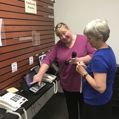 Debbie Jones, Resource & Technology Manager, demonstrates assistive listening technology at NVRC.