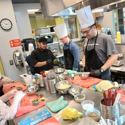 Cooking group in kitchen