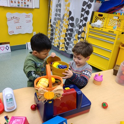 Two students playing together in class.