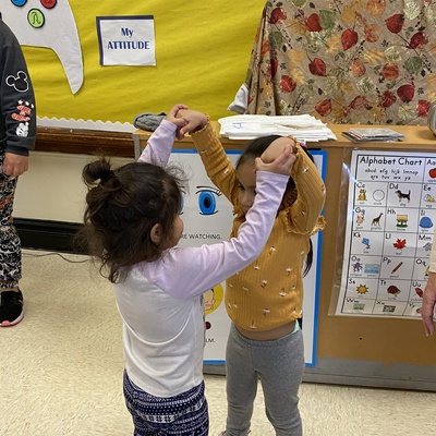Two students dancing together.